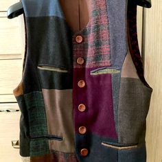 a vest made out of different colored fabrics