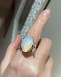 Rare authentic natural Earthmined Contraluz Mexican opal set in  large vintage Modernist ring crafted in solid sterling silver - fully tested and hallmarked. the pointed/raised dot is 14k yellow gold.   this large Art ring came directly from Mexico and made by an artisan at Taxco, Guerrero.  Taxco is a colonial city located in the state of Guerrero, Mexico. Known for its silver mines and historic architecture, Taxco is a popular tourist destination for visitors from around the world. The opal is Minimalist Silver Opal Ring, White Opal Celestial Ring, Celestial White Opal Ring, Oval Opal Jewelry Collectible, Celestial Hallmarked Jewelry With Oval Stones, Collectible Oval Opal Jewelry, Celestial Style Hallmarked Oval Jewelry, Unique White Gold Opal Ring Gift, One-of-a-kind Opal Jewelry For Anniversary