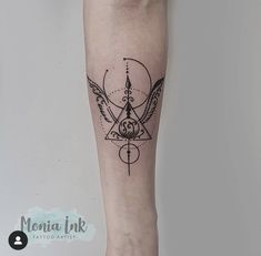 a black and white tattoo on the leg of a person with a bird in it