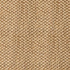 an up close view of the texture of a woven fabric with brown and tan colors