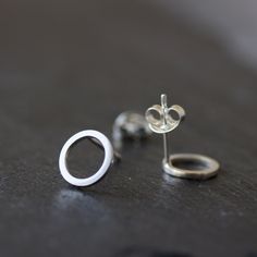 "These minimalistic stud earrings are full of tenderness and eternal beauty. They ideally pass to your outfit, no matter what style you prefer. These studs are perfect for everyday use, they are so lightweight, that you'll never feel them. The earrings are made of sterling silver. The diameter of the circle is approx. 6 mm (1/4\"). The earrings are made to order, the production time is up to 5 days. You will receive them gift wrapped for no additional charge." Silver Earrings With Simple Design For Everyday, Simple Design Silver Earrings For Everyday, Dainty Sterling Silver Earrings With Simple Design, Minimalist Round Earrings With Simple Design, Simple Small Silver Earrings, Minimalist Sterling Silver Earrings, Classic Sterling Silver Earrings With Simple Design, Minimalist Sterling Silver Jewelry, Minimalist Hypoallergenic White Gold Earrings