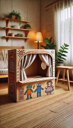 a child's play house made out of cardboard and painted with children's drawings