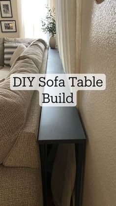 a couch sitting next to a window with the words diy sofa table build