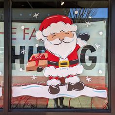 a santa clause is in the window of a store