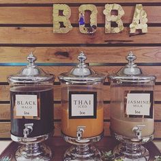 three glass jars filled with different types of food