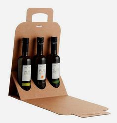 three bottles of wine in a cardboard box