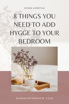 flowers and candles on a bed with text that reads 8 things you need to add hygge to your bedroom