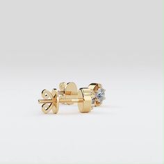 Crafted in 1.99 grams of 14K Yellow Gold, the earrings contain 2 Stones of Round Natural Diamonds with a total of 0.50 carat in H-I Color and VS-SI Clarity. Yellow Earrings, Natural Diamonds, Diamonds, Yellow Gold, Stone, Yellow, Gold, Color, Design