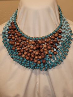 In excellent condition. Comes with original box and jewelry bag. Turquoise colored and wooden beaded necklace that hangs down like a bib necklace. Please look at the pictures for details and condition or message me with any questions Beaded Bib Necklace, Statement Jewellery, Necklace Design, Bib Necklaces, Joan Rivers, Jewelry Bag, Southwestern Style, Bib Necklace, Turquoise Color