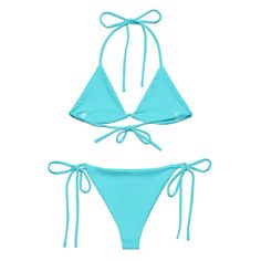 boxedcat ICE ICE BABY Bikini Embrace the sun, sand, and sea with our stunning vibrant blue bikini. Each curve-hugging piece promises not just a fashion statement but a commitment to our planet. Not only are these designs exclusive to boxedcat, there are multiple ways to tie this top to create a look that's as unique as you are. Say goodbye to tan lines and hello to your perfect beach look. Experience the caress of our soft, stretchy fabric that is double layered for quality and provides UPF 50+ Adjustable Beachwear Swimwear For Pool, Uv Protection Swimwear With Tie-side Bottom, Uv Protection Tie-side Swimwear, Turquoise Tie-side Bottom Swimwear For Beach, Uv Protection Swimwear With Tie-side Bottom For Pool, Uv Protection Tie-side Swimwear For Pool, Light Blue Beachwear Swimwear For Sunbathing, Stretch Turquoise Swimwear For Pool, Light Blue Tie-side Swimwear For Beach Season