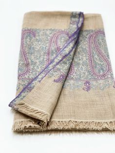 Luxurious, 100% pashmina scarves are hand-woven and hand-embroidered with care by Unesco awarded artisans based in Kashmir, India. Each scarf has the artisan's embroidered signature on it. This level of craftmanship will be almost extinct in about 20-30 years, making this scarf a gorgeous heirloom piece which you'll cherish for years. The scarves are approximately 80 x 41 inches. 100% hand-woven Pashmina  Dry clean only. Cream Pashmina Traditional Scarf, Traditional Cream Pashmina Scarf, Cream Traditional Pashmina Scarf, Cream Embroidered Pashmina Scarf, Bohemian Pashmina Scarves With Intricate Embroidery, Bohemian Pashmina Scarf With Intricate Embroidery, Beige Pashmina Shawl With Intricate Embroidery, Beige Embroidered Pashmina Scarf, Elegant Handloom Pashmina Shawl