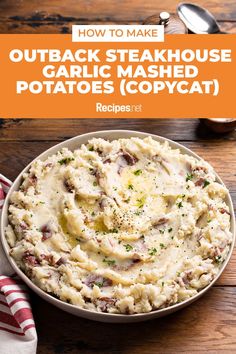 a bowl filled with mashed potatoes on top of a wooden table