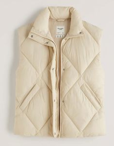 New Abercrombie "Oversized Fit" Quilted Puffer Vest  French Vanilla Size Large We have other sizes and colors in our store. There's nothing quite like the feeling of putting this vest on!  Our new puffer vest in a wind-and water-resistant fabric. Featuring quilting details, flattering wedge fit, extended shoulder detail, tall collar, zip and snap up front, cozy interior lining and pockets.  Imported. Retail is $99.00 On Sale Now $68.50 I would recommend true to size for an oversize fit, and sizi Fleece Vest Women, Feather Vest, Camo Vest, Faux Suede Vest, Oversized Vest, Jean Jacket Vest, Fall Vest, Quilted Puffer Vest, Suede Vest