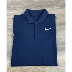 Elevate Your Style With This Sleek Nike Navy Blue Polo Shirt Designed For Men. Crafted With Dri-Fit Technology, This Shirt Ensures You Stay Cool And Dry When You're On The Move. This Short-Sleeved Polo Shirt Features The Iconic Swoosh Emblem, Making It A Stylish Choice For Any Occasion. The Shirt Is Available In An Xs Size And Is Perfect For Those Who Prefer A Regular Fit. Whether You're Dressing Up For A Casual Day Out Or Hitting The Golf Course, This Polo Shirt Is An Excellent Addition To Your Wardrobe. New Without Tags 100% Polyester Fz5646-451 Retail $55 8/4496 Navy Blue Polo Shirt, Polo Shirt Design, Red Polo Shirt, Blue Polo Shirt, Resort Shirt, Shirt Designs For Men, Blue Polo Shirts, Blue Camo, Striped Polo Shirt