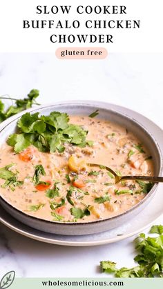 the slow cooker buffalo chicken chowder is ready to be eaten and served with cilantro