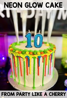 a birthday cake with the number ten on it and candles in the middle that say neon glow cake 10 from party like a cherry