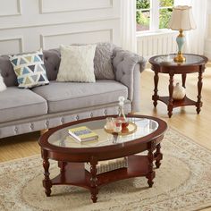 a living room with two couches, a coffee table and a rug on the floor