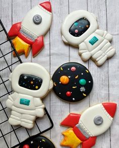 some cookies are decorated with space related items