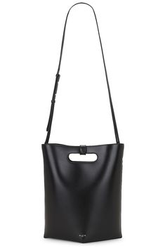 Find ALAÏA Folded Tote Bag on Editorialist. The ALAÏA Folded Tote Bag is crafted from calfskin leather with a suede lining. The bag features a top handle with a 1.25 drop, a detachable and adjustable shoulder strap with a 18 drop, and a structured handle with a detachable snap button strap. The bag also features an open top, one main compartment, and an attached interior calfskin leather zipper pouch. The bag measures approximately 10 W x 12.5 H x 5.5 D. It is made in Italy. Leather Box Bag For Shopping, Leather Shoulder Box Bag For Shopping, Leather Crossbody Box Bag For Shopping, Designer Leather-lined Bucket Shoulder Bag, Leather Box Bag With Detachable Handle In Tote Shape, Leather Box Bag With Detachable Strap In Tote Shape, Leather Tote Box Bag With Detachable Strap, Leather Box Bag With Detachable Handle And Tote Shape, Leather Box Bag With Detachable Handle