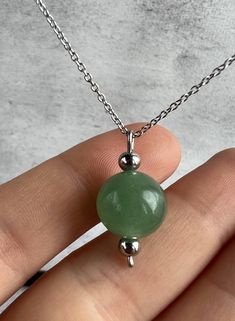 Jade Clavicle Chain Necklace, Minimalist Pendant Necklace For Healing, Minimalist Jade Round Pendant Jewelry, Minimalist Jade Round Pendant Necklace, Minimalist Green Round Bead Necklaces, Minimalist Green Necklaces For Jewelry Making, Minimalist Necklaces For Healing, Minimalist Jade Jewelry, Minimalist Crystal Pendant Necklace With Clavicle Chain