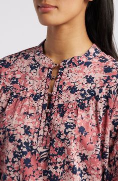 A gathered yoke creates volume in a flower-strewn cotton popover top fashioned with balloon sleeves and fabric-covered buttons. 24" length (size Medium) Button half placket Band collar Split neck Long sleeves with button cuffs 100% cotton Machine wash, tumble dry Imported