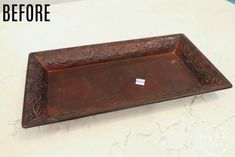 a brown tray sitting on top of a counter next to a white counter with the words before and after