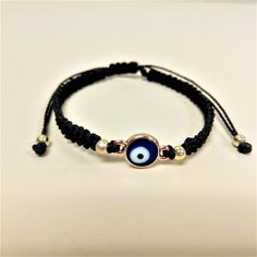 This cute and adorable wish bracelet with evil eye is individually handmade with 1 mm polyester waxed cord and make the perfect gifts for moms, dads, siblings, realatives, friends, lovers and all beloved ones for every special occasion. There is a belief that the wearer has to make a wish while tying on the bracelet, and when the bracelet falls off naturally, their wish is said to be ready to come true. Comes with a wish card if requested How to Order: - We offer 7 different options. Choose your Adjustable Spiritual Braided Bracelet With Evil Eye, Adjustable Braided Evil Eye Bracelet For Spiritual Protection, Adjustable Spiritual Evil Eye Braided Bracelet, Adjustable Black Bohemian Evil Eye Bracelet, Adjustable Evil Eye Friendship Bracelet, Adjustable Evil Eye Bracelet For Friendship, Symbolic Adjustable Friendship Bracelets, Black Spiritual Friendship Bracelets With Evil Eye, Spiritual Black Friendship Bracelets With Evil Eye