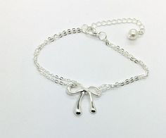 "Bridesmaid Gift - Sterling Silver Plated Bow Bracelet with pearl on adjustable sterling silver plated chain - carded for gift giving - \"I can't tie the knot without you by my side - Will you be my bridesmaid? \" bracelet measures 6.5\" long but can adjust to be 8.5\" long. Thank you for visiting my shop! We do our best to ship orders out within one business day. Order ship USPS first class mail unless you request another method of shipping. http://www.etsy.com/shop/doodlebead" Elegant Adjustable Bracelet With Bow, Elegant Adjustable Bracelets With Bow Detail, Elegant Adjustable Bracelet With Bow Detail, Silver Bracelets For Party, Silver Bracelets For Party As A Gift, Silver Bracelets For Party Or Gift, Silver Bracelets For Party, Great As Gifts, Valentine's Day Formal Bow Jewelry, Formal Bow Jewelry For Valentine's Day