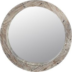 a round mirror made out of wood with white paint on the bottom and grey trim