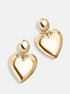 The Sheri Earrings make heart earrings modern. This pairing of gold drop earrings features a simple stud connected to an elegantly oversized glossy gold heart drop. We love this style for date night, girls' night, or really any night, as a matter of fact. Gold Medallion Necklace, Bridal Earrings Studs, Bauble Bar, Safety Pin Earrings, Ups Shipping, Heart Shaped Jewelry, 18k Gold Earrings, Spring Event, Statement Drop Earrings