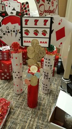 some casino themed items are sitting on the table and ready to be used as centerpieces