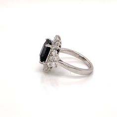 Start a conversation with this show stopping Art Deco inspired ring. A show stopping 4.22 ct black Spinel is the centerpiece of this creation, surrounded by a combination of 1.6 ct VS quality round, pear, and tapered baguette shaped diamonds. Inspired by the Art Deco period, we have created both contrast and symmetry with the depth of black hue from the Spinel and the contrast of the scintillating symmetrical diamonds that surround it. A collector piece sure to be an heirloom for many generation Art Deco Period, Black Spinel, Art Deco Inspired, White Diamonds, Gemstone Colors, Diamond White, Types Of Metal, Halo, Diamond Ring