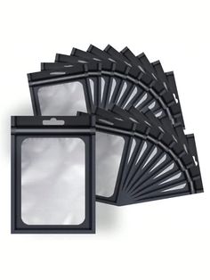 six pieces of black plastic window on a white background, each with a square opening in the middle