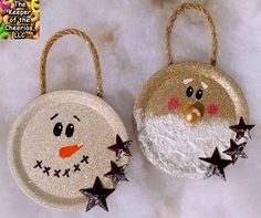 two christmas ornaments made to look like santa claus and snowman with stars on them