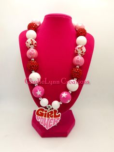 -  Girl Power bubblegum bead necklace with pink and white beads and silver spacers. So cute. -  Your little girl or toddler will look like a Princess in this beautiful, fun, Chunky Bubblegum Necklace. -  This necklace would be the perfect dazzling addition for your little Princess outfit to wear for any special occasion. -  Necklace length 17"  20mm beads & 14mm beads Materials:  acrylic beads, resin beads, bead wire, crimp tubes, jump rings, stainless steel clasps **Custom Orders Are Welcome** Ready to ship in 1 to 3 business days by USPS First Class Mail. - Returns & Exchanges I do accept returns and exchanges.  Just mail it back to me within 7 days of delivery. WARNING The jewelry is made with small beads and small parts.   Please do not leave your child unattended while wearing the jew Playful White Beaded Necklaces For Birthday, Playful White Beaded Necklace For Birthday, Fun Pink Beaded Necklaces With Letter Beads, Pink Letter Beads Fun Necklaces, Cute White Necklace With Heart Beads, Playful Pink Beaded Necklaces For Birthdays, Playful Pink Beaded Necklaces For Birthday, Playful Pink Beaded Necklace For Birthday, Pink Beaded Necklace For Valentine's Day