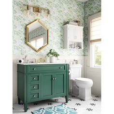 a bathroom with green and white wallpaper and a mirror on the wall above the sink