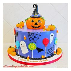 a cake decorated with candy and halloween decorations