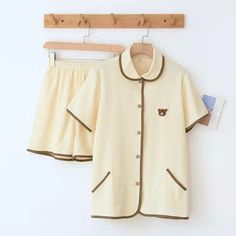 Simple is beautiful, thus, these Cotton Knitted Couple 2 Piece Short Sleeve Pajama Set is ensuring comfort while you sleep. It comes with a buttoned shirt while shorts are at the bottom. It has two little pockets on the shirt which gives it a cute touch. Buying this comfy night suit won't break your bank! This loungewear is all you need to help relax at home. They are soft and easy to touch which projects versatility and effortless grace in every step you take. Made to make you feel good, each o Cotton Loungewear Sets With Button Closure, Cozy Cotton Short Sleeve Sleepwear, Cozy Cotton Sleepwear With Short Sleeves, Casual Cotton Sleepwear With Button Closure, Casual Loungewear Sets With Button Closure, Beige Loungewear Sets With Pockets, Collared Loungewear Sets With Buttons, Cotton Short Sleeve Set With Button Closure, Collared Sets With Buttons For Loungewear