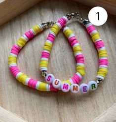 two bracelets with the word summer written on them in white, yellow and pink beads