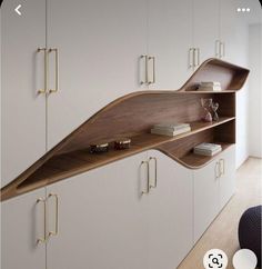 the shelves are made out of wood and have brass handles on them, along with bookshelves