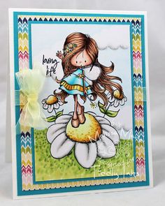 a card with a girl on top of a flower