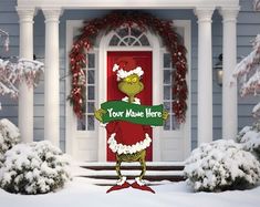 the grinch is holding a sign in front of a house with snow on it