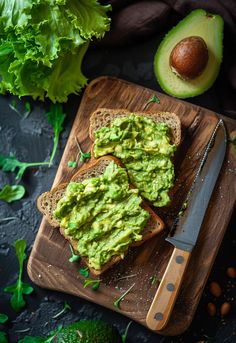 avocado spread on bread with knife and lettuce