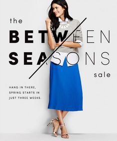 a woman standing in front of a white wall with the words between seasons sale on it