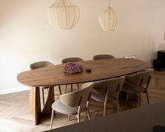 a dining room table with chairs around it