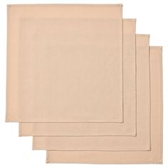 four placemats in beige linen on a white background