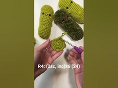 two crocheted items are being held up by someone's hands with scissors