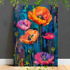 an abstract painting of colorful flowers on a blue background