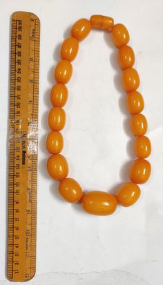 Beautiful Tibetan Ethnic design Bold tribal Resin Necklace This is a Beautiful long style amber color resin bold beads necklace (new) from India. It looks very beautiful and unique. Very bold, fine and well made. Luxury Spiritual Orange Beaded Necklace, Orange Necklaces With Large Oval Beads, Orange Necklace With Large Oval Beads, Color Resin, Ethnic Design, Jewelry Essentials, Resin Necklace, Amber Color, Resin Beads