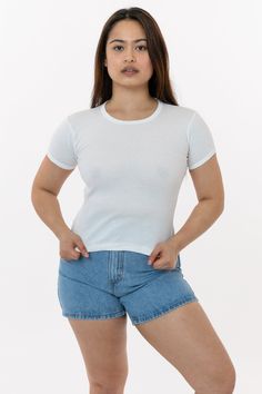 This original classic girl tee was designed by Dov Charney in the early 90s and remains an essential summer tee 30 years later. This top is made of our 100% cotton 1x1 baby rib and features a crew neckline and short sleeves with a binding finish and the perfect full-length fit that can be worn tucked or untucked and suits any occasion. This casual top exudes minimal elegance with its refined and tested fit. Our combed cotton baby rib is made of soft 30 singles yarn and stretches up to 2 times it Basic Crew Neck Summer Tops, Fitted Basic Summer T-shirt, Classic White Short Sleeve Top For Summer, Fitted Pre-shrunk Summer Tops, Pre-shrunk Fitted Summer Top, Basic Unisex T-shirt For Summer, Unisex Basic T-shirt For Summer, Fitted Cotton T-shirt Basic Style, Fitted Basic Cotton T-shirt